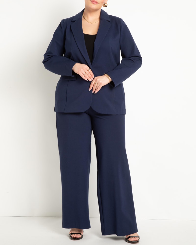 Front of a model wearing a size 26 The Ultimate Stretch Suit Wide Leg Pant in Maritime Blue by ELOQUII. | dia_product_style_image_id:273031